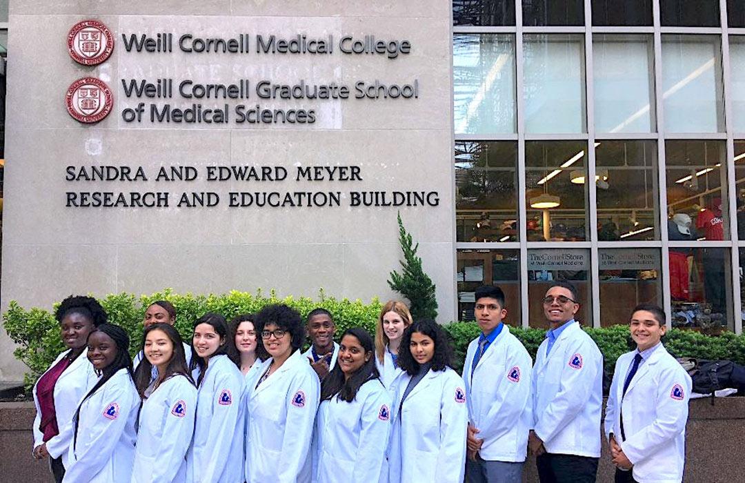 Bella Karabinas at Cornell with colleagues in lab coats