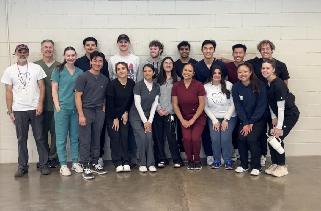 A group photo of people participating in the free dental clinic.