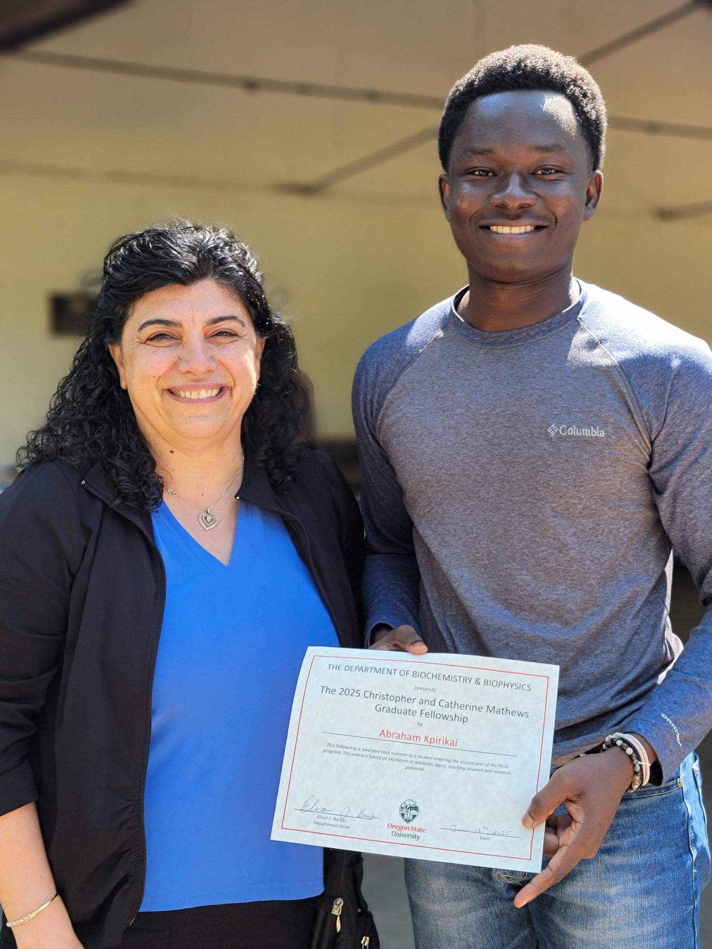 Elisar Barbar and Abraham Kpirikai with award 