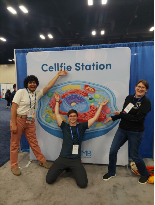 Three people posing.