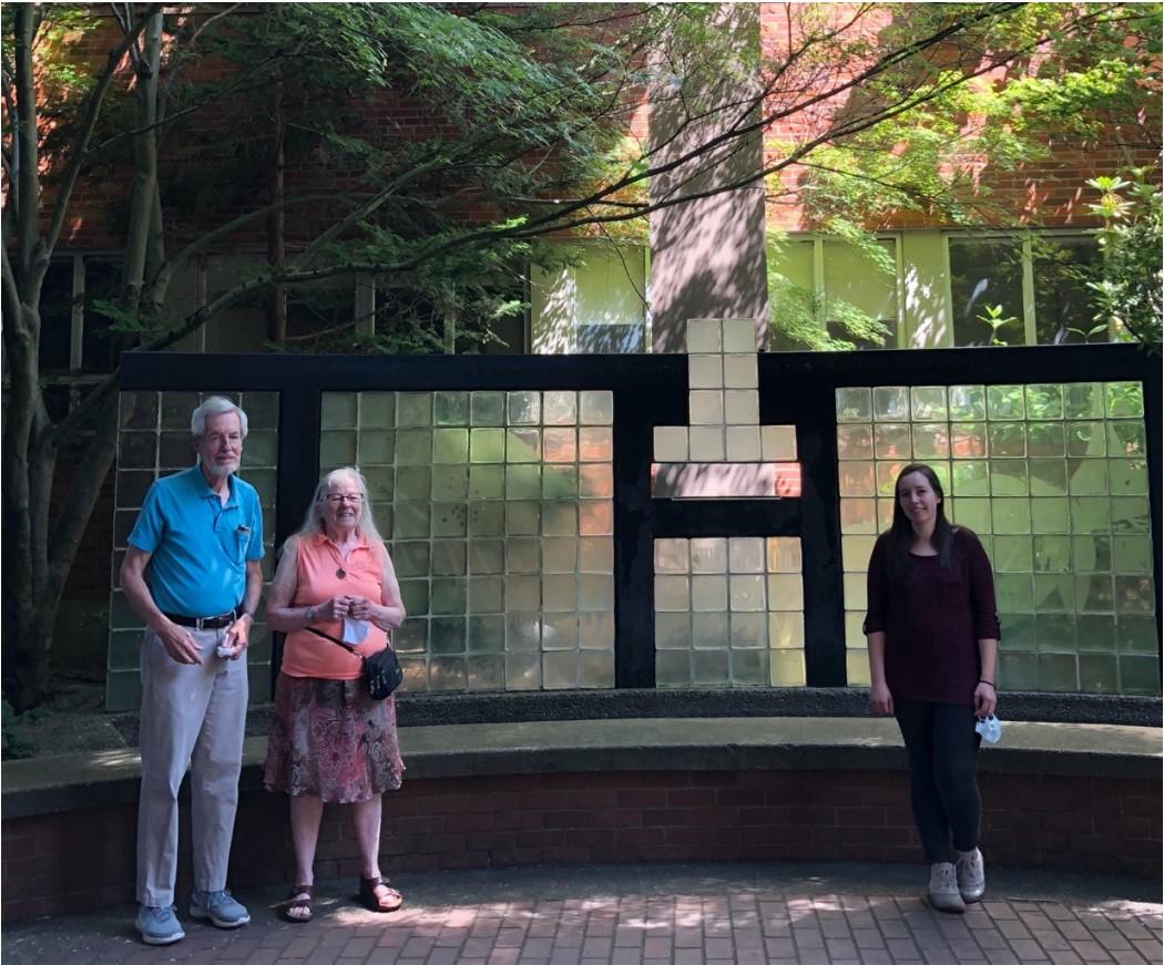 Three people posing six feet apart.