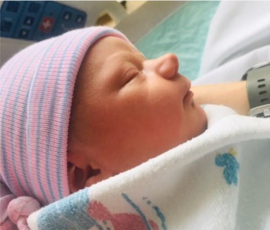 Swaddled newborn baby.
