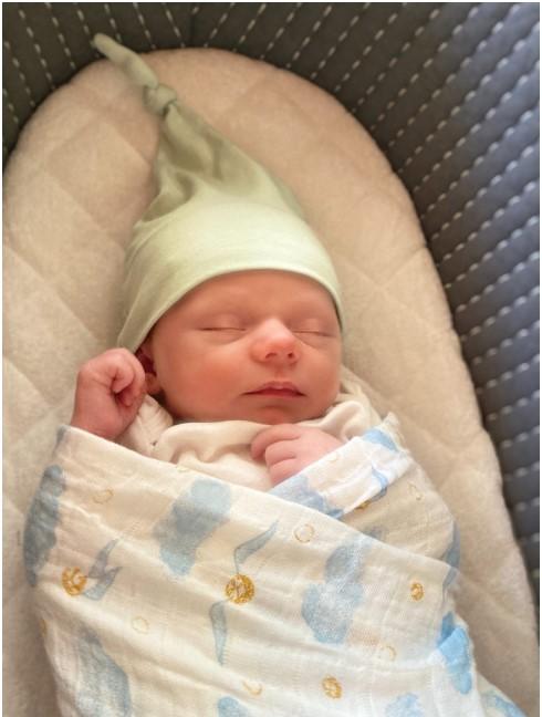 Swaddled newborn baby.