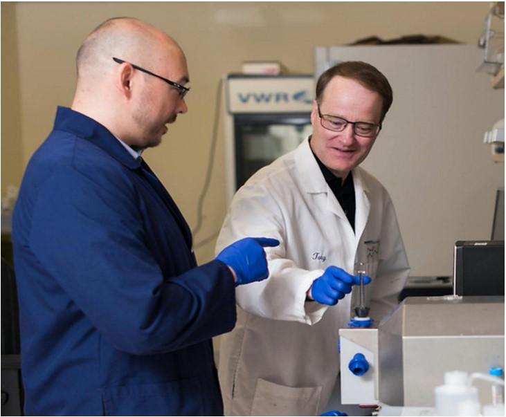 Two men working in a lab.