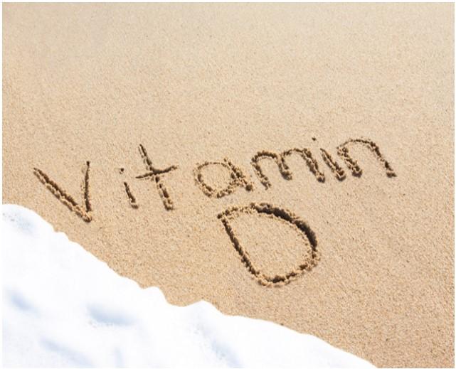 Vitamin D written in sand.