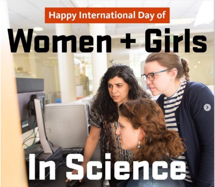 Three women looking at computer.