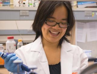 Trisha Chau working in a lab.