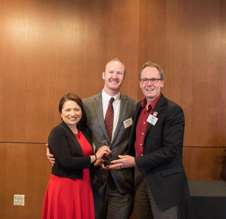 Luisa and Nathan Snyder receiving the Young Alumni Award from College of Science Dean Roy Haggerty