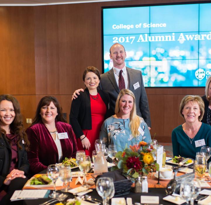 Young Alumni Award recipients Nathan and Luisa Snyder (standing)