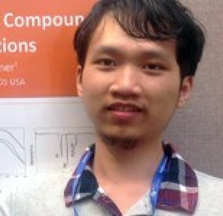 Hanyang Zhang in front of research poster