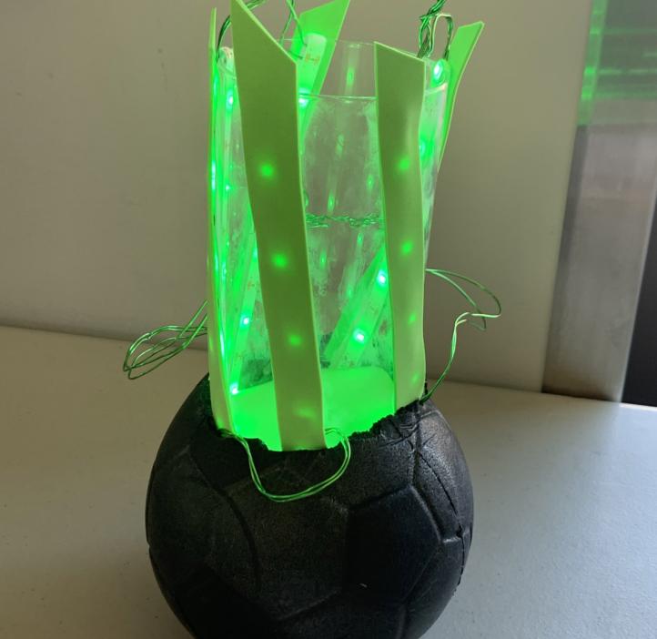 A glowing green structure representing a bioluminscent protein
